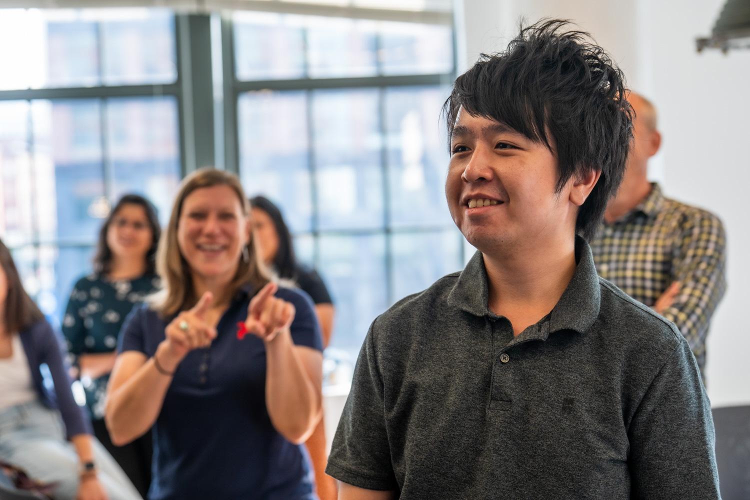 Pixability employees cheering at a company event