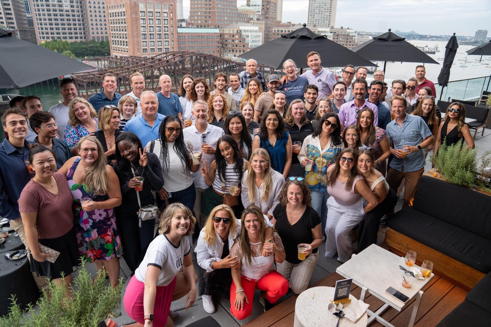 Group photo of the Pixability team on a rooftop terrace