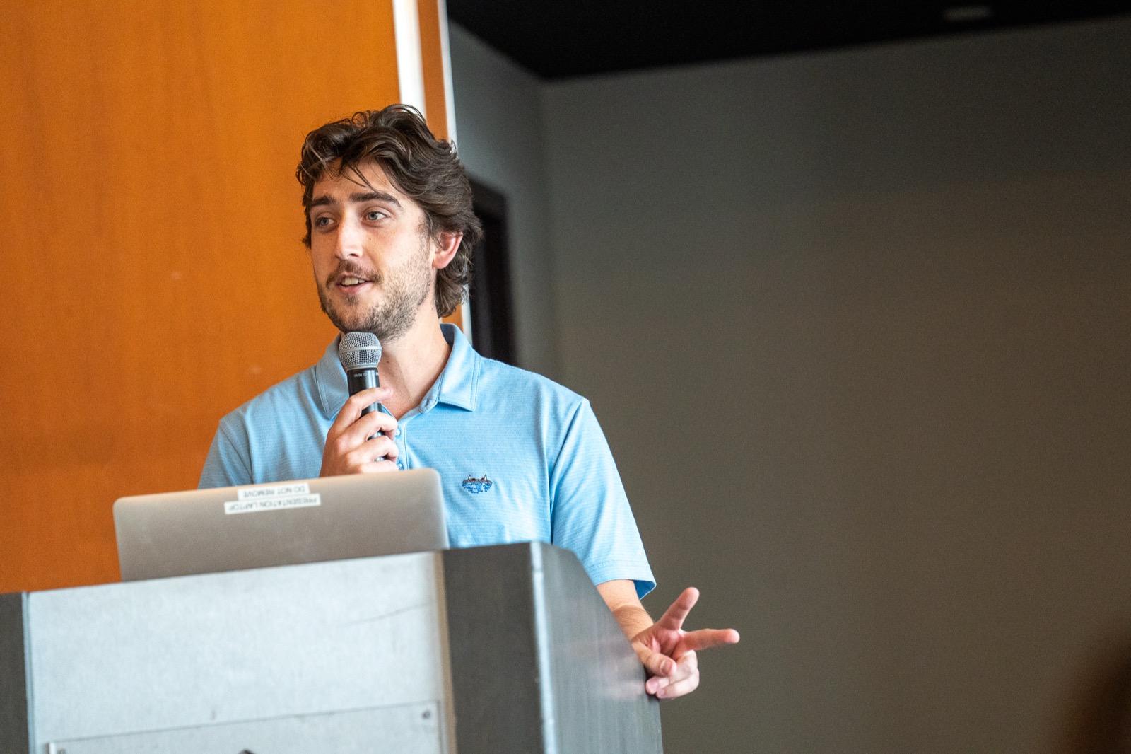 A Pixability team member speaking at a podium