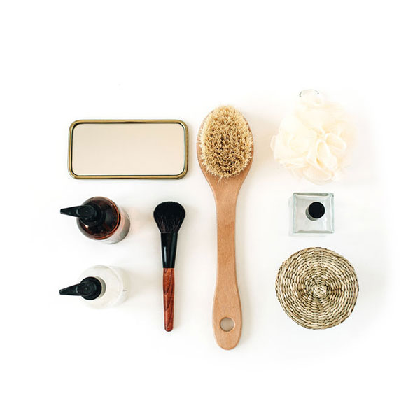 Various beauty tools arrayed on white background.