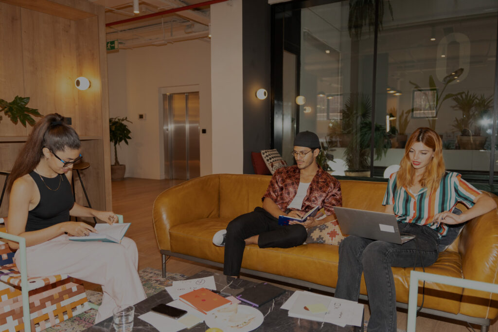Direct Flash User Generated Content Of Business Concept. Colleagues Working Together In A Beautiful And Colorful Office.